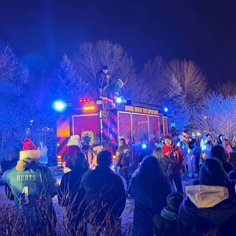 Falling snow effect over a night crowd at a South Jersey township winter event